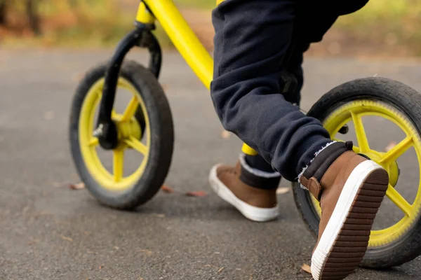 Legs Little Boy Casual Pants Brown Sports Shoes Riding Balance — Stock Photo, Image