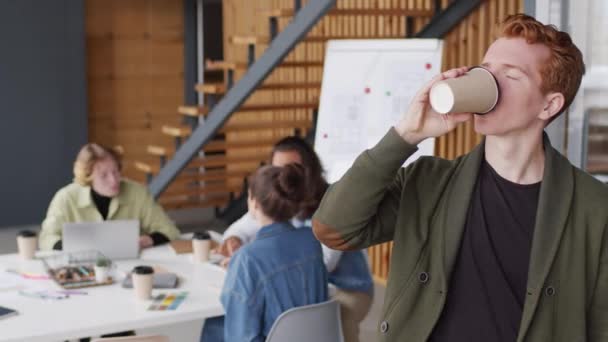 Portrait Pan Young Businessman Drinking Coffee Cup Looking Camera Meeting — Stock Video