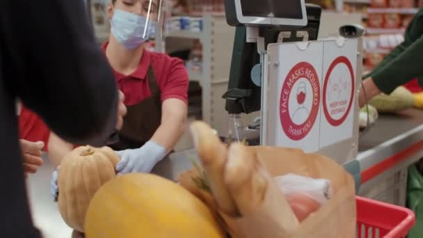 Medium Shot Young Female Cashier Wearing Special Uniform Protective Plastic — Stock Video