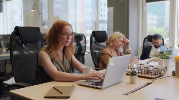 Medium Shot Young Female Office Worker Typing Laptop Sitting Desk — Stock Video