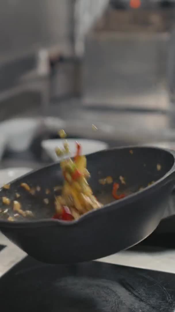 Vertical Slow Motion Close Chef Hand Tossing Multicolored Vegetables Wok — Stock Video