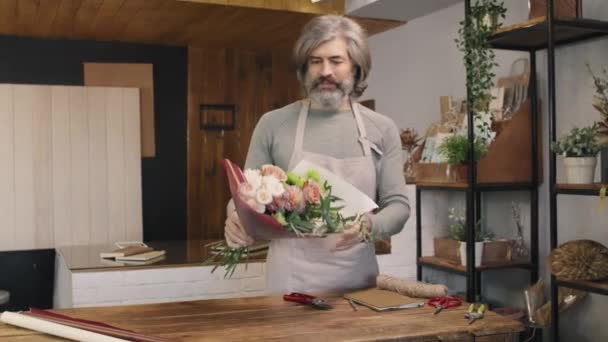 Medium Portrait Smiling Male Florist Looking Camera Standing Wooden Counter — Stock Video