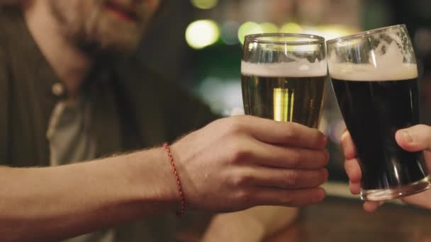 Slow Motion Close Unrecognizable Male Friends Toasting Beer Glasses Bar — Stockvideo