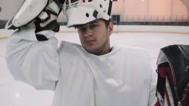 Medium Closeup Arc Shot Portrait Slowmo Young Male Hockey Goaltender — Stock Video