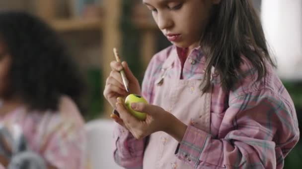 Tilt Cute Girl Painting Yellow Easter Egg Arts Crafts Class — Stock Video