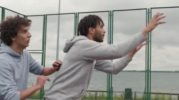 Handheld Tracking Shot Young Man Dreadlocks Catching Ball His Teammate — Stock Video