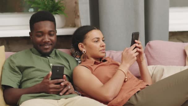 Medium Shot Young Biracial Couple Chilling Comfy Sofa Together Using — Stock Video