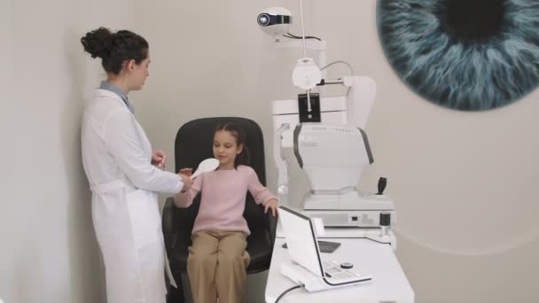 Medium Shot Little Girl Holding Occluder Doing Her Eye Checkup — Stock Video