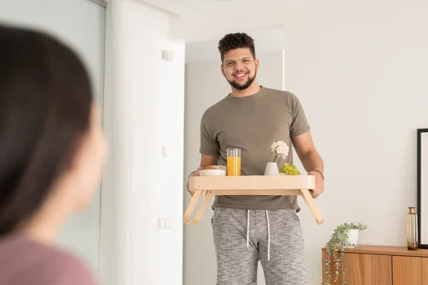 Happy Young Bearded Man Carrying Wooden Tray Selfmade Breakfast While — Stock Photo, Image