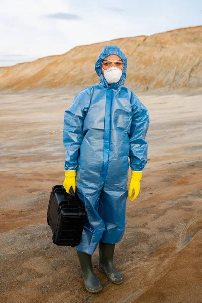 Young Female Researcher Protective Workwear Holding Case Samples While Standing Royalty Free Stock Photos