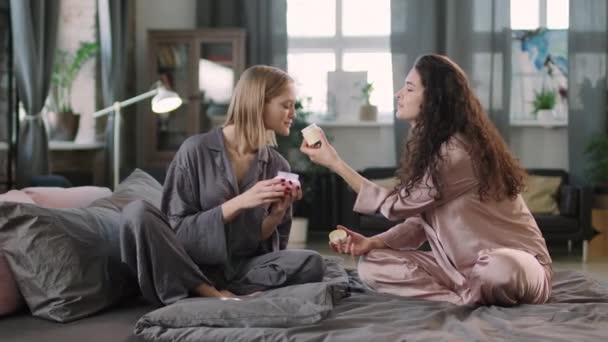 Medium Pan Shot Slowmo Two Young Pretty Women Silk Pajamas — Stock Video