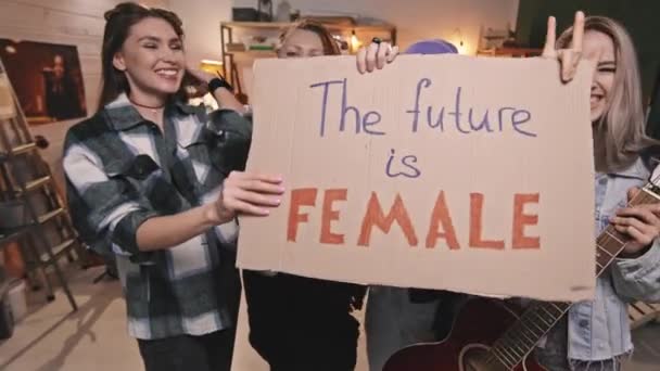 Handheld Medium Slowmo Four Cool Young Women Playing One Rock — Stock video