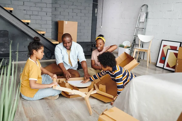 Young African Family Sitting Floor Large Living Room New Flat — Stock Photo, Image