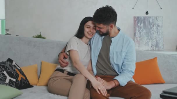 Medium Portrait Cheerful Young Latin Hispanic Couple Sitting Comfortable Grey — Stock Video