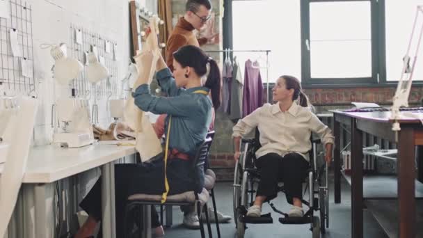 Slowmo Shot Female Fashion Designer Wheelchair Talking Her Team Working — Stock Video