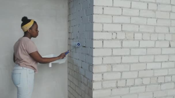Side View Shot African American Woman Painting Brick Wall While — Stock Video