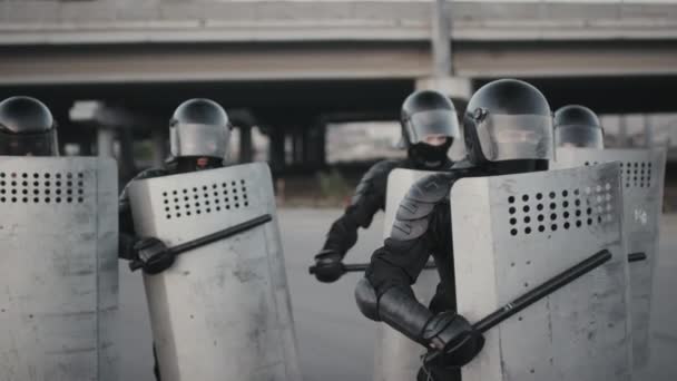 Slowmo Shot Unrecognizable Riot Police Officers Full Gear Beating Shields — Stock Video