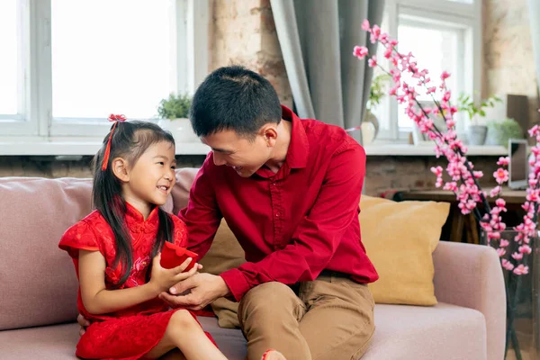 Happy little girl with postcard and her father — Stock Photo, Image