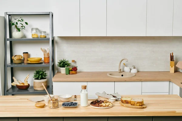 Some organic food on wooden kitchen table — Stock Photo, Image