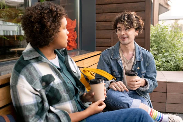 Happy teenage students in casualwear discussing college points — Stock Photo, Image