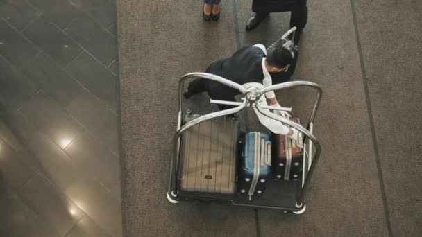 Top View Shot Contemporary Tourist Couple Giving Suitcases Young Male — Stock Video