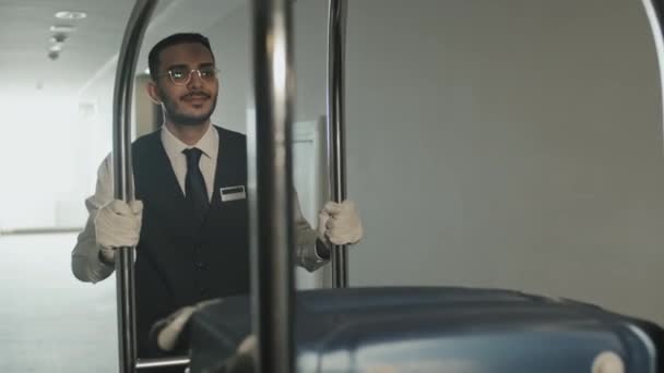 Slowmo Shot Young Male Porter Carrying Baggage Cart Walking Empty — Stock Video