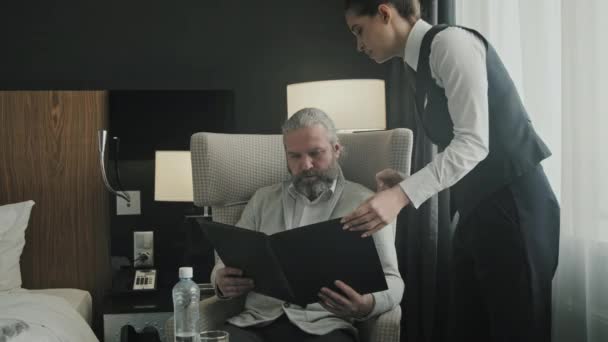 Medium Shot Mature Businessman Sitting Chair His Hotel Room Young — Stock Video