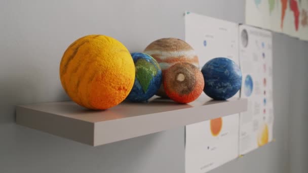 Close Handheld Tracking Shot Models Planets Lying Shelf Classroom Childs — Stock Video