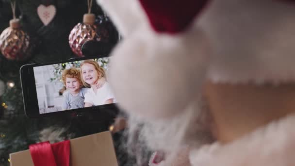 Shoulder Slowmo Close Unrecognizable Santa Claus Talking Little Boy Girl — Stock Video