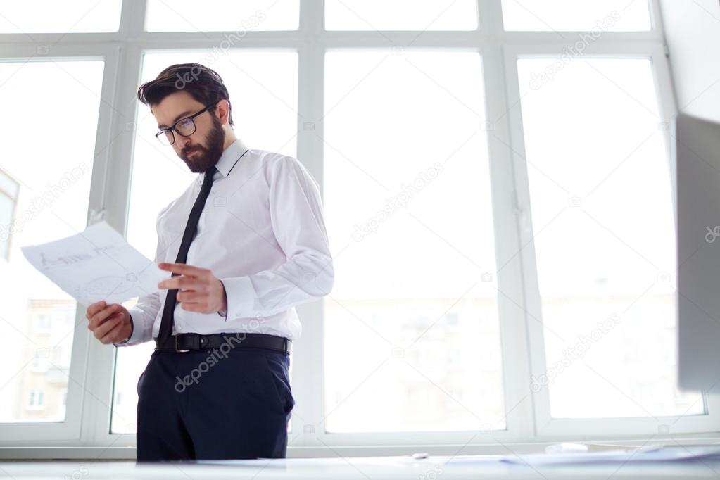 Businessman reading paper