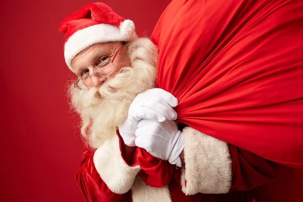 Santa claus met enorme zak — Stockfoto