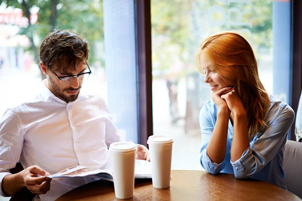 Young couple having rest in cafe — ストック写真