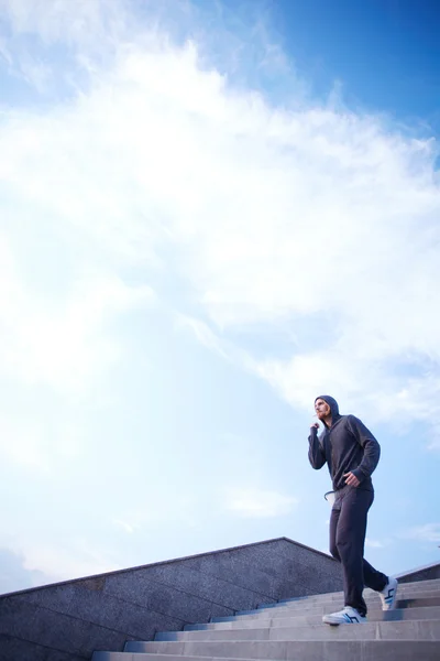 Sportsman running down steps — Stock Photo, Image