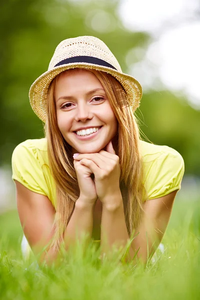 Happy girl in hat lying — Stock Photo, Image