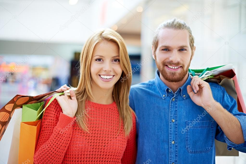 Happy couple with purchases