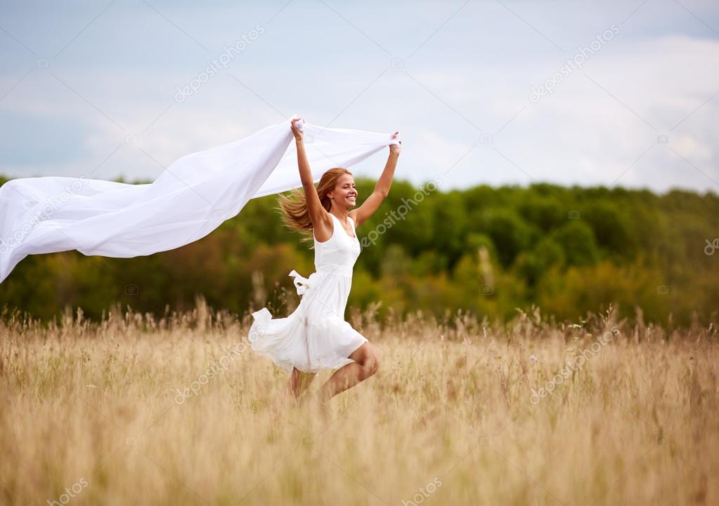 Happy woman with white fabric