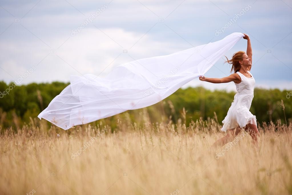 Happy woman with white fabric