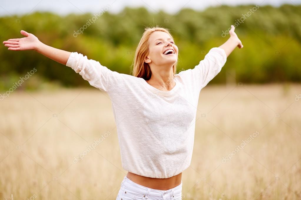 Happy woman with outstretched arms