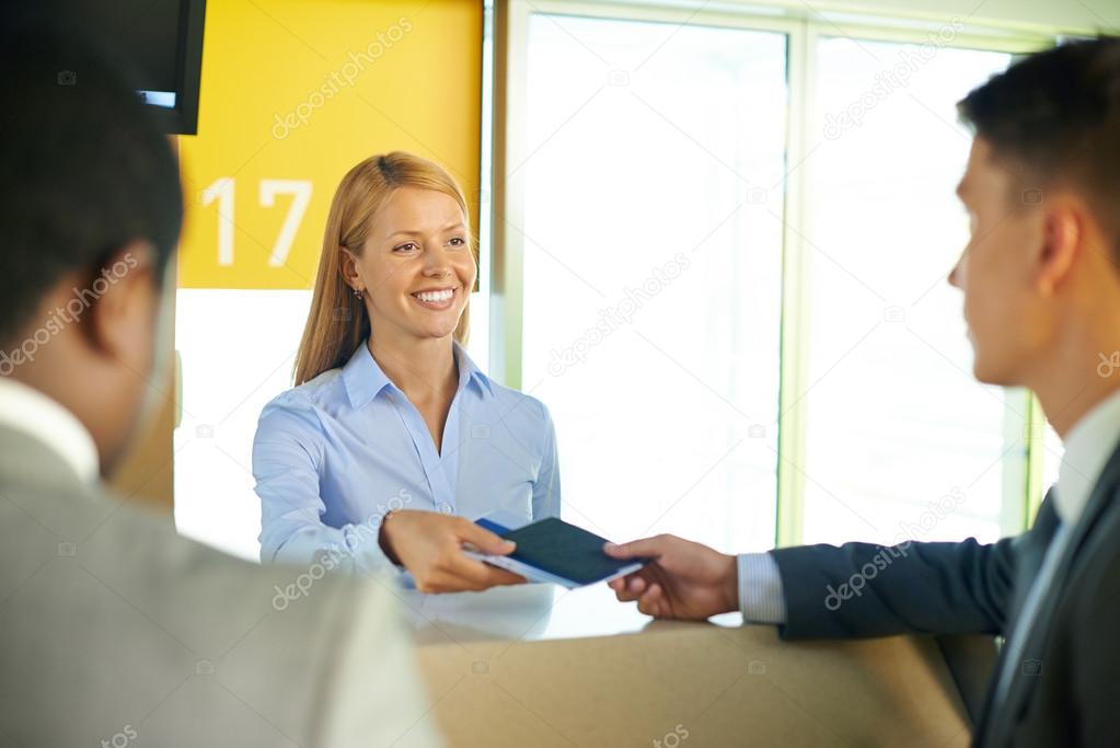 Businessman at registration in airport