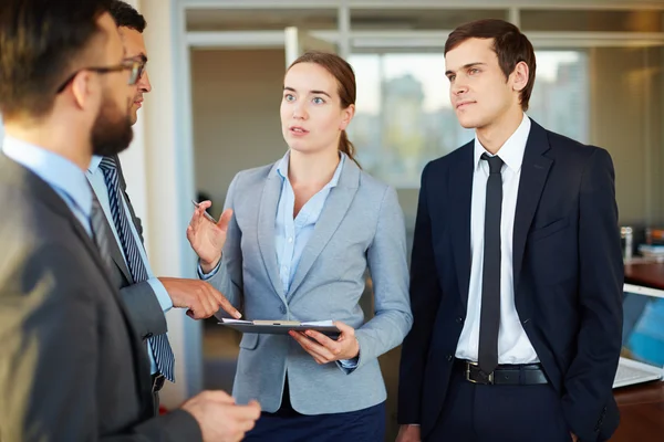 Businesswoman looking at her colleague — Stock Photo, Image