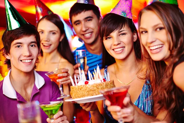 Friends with birthday cake Stock Image