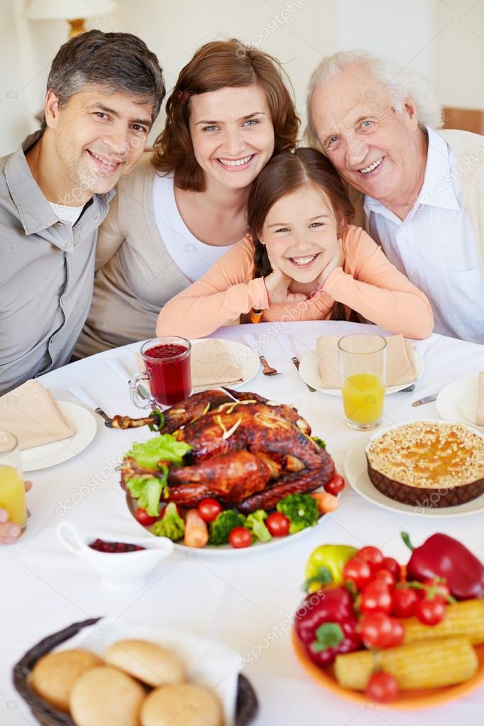 Family by festive table