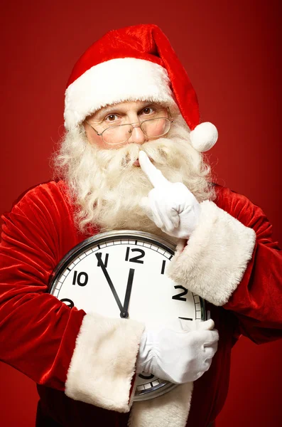 Santa celebración reloj de Navidad —  Fotos de Stock