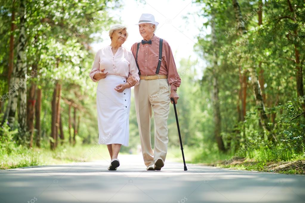 Happy seniors in park — Stock Photo © pressmaster 55488189