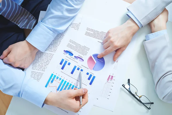 Hands pointing at business document — Stock Photo, Image