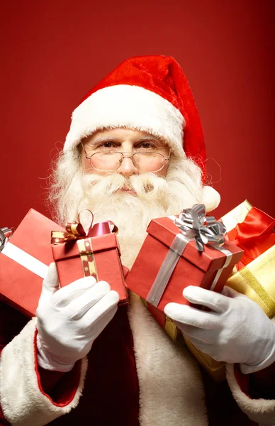 Santa Claus with gift boxes — Stock Photo, Image