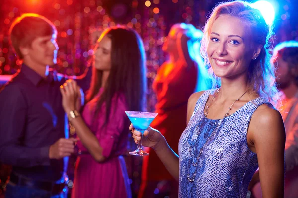 Girl with cocktail in nightclub Royalty Free Stock Images