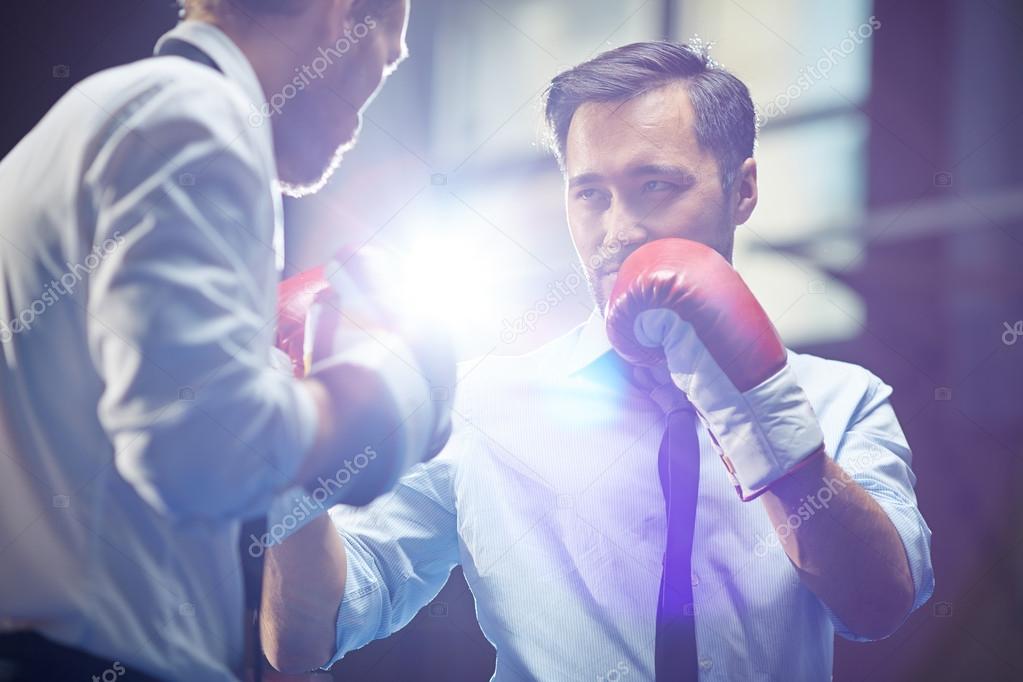 Businessman in boxing gloves