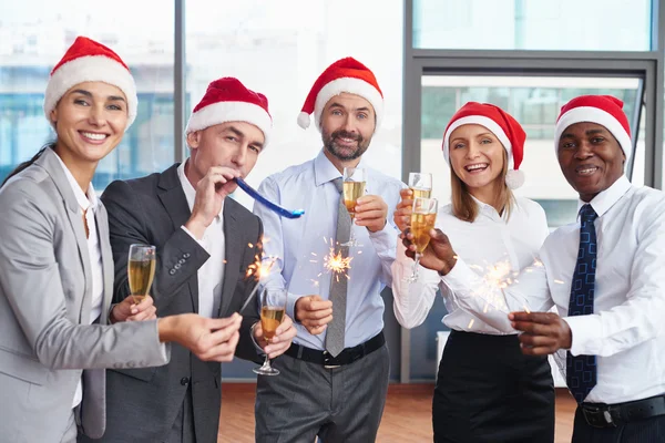 Colleagues in Santa caps — Stock Photo, Image