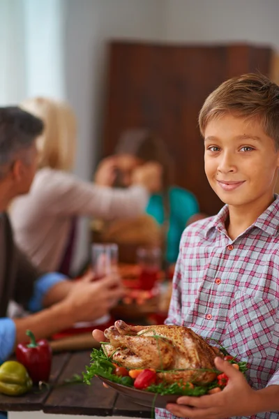 Boy with roasted turkey — Stock Photo, Image